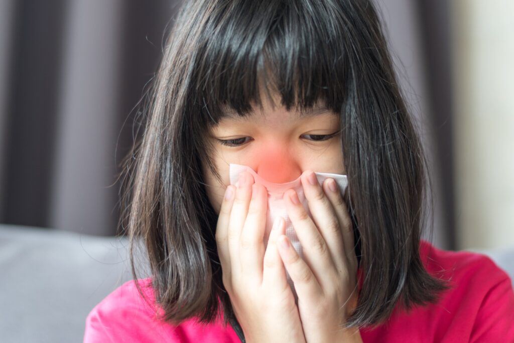 Lady with rhinorrhea.